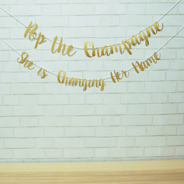 Pop the Champagne, She Is Changing Her Name Banner
